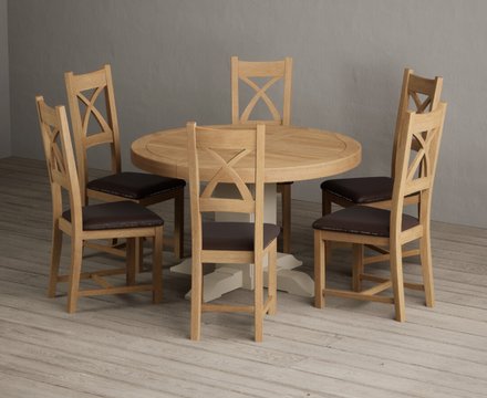 Extending helmsley oak and cream painted pedestal dining table with 6 brown natural solid oak chairs