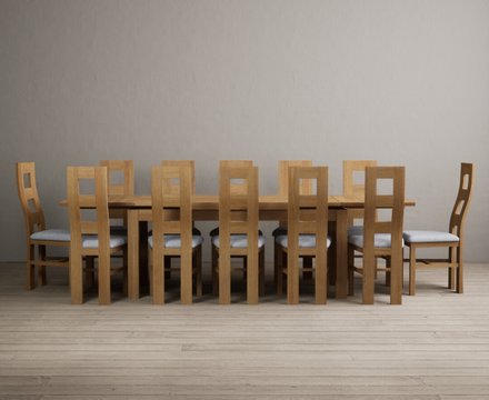 Extending buxton 180cm solid oak dining table with 12 blue natural chairs