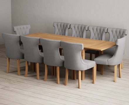 Extending thetford 150cm solid oak table with 10 grey clara chairs