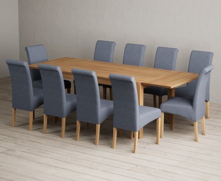 Extending thetford 150cm solid oak dining table with 10 blue scroll back chairs
