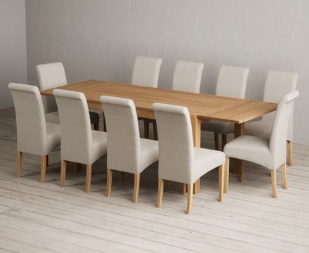 Extending thetford 150cm solid oak dining table with 10 natural scroll back chairs