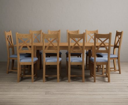 Extending thetford 150cm solid oak dining table with 10 blue natural solid oak chairs