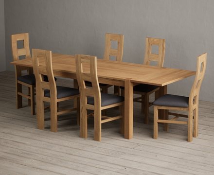 Extending thetford 150cm solid oak dining table with 6 charcoal grey natural chairs