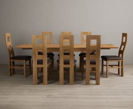 Extending thetford 150cm solid oak dining table with 8 brown natural chairs
