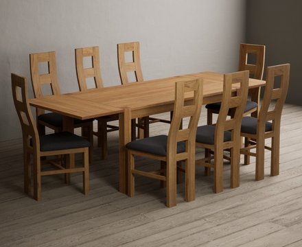 Extending thetford 150cm solid oak dining table with 8 charcoal grey natural chairs