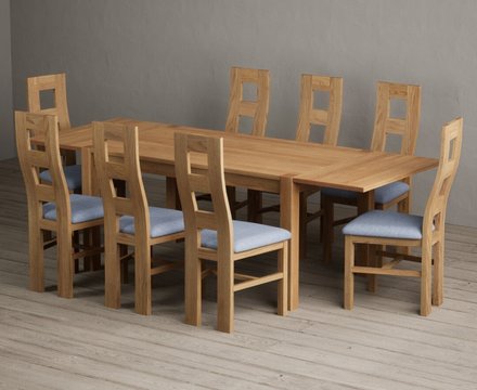 Extending thetford 150cm solid oak dining table with 8 blue natural chairs