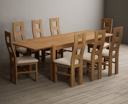 Extending thetford 150cm solid oak dining table with 8 linen natural chairs