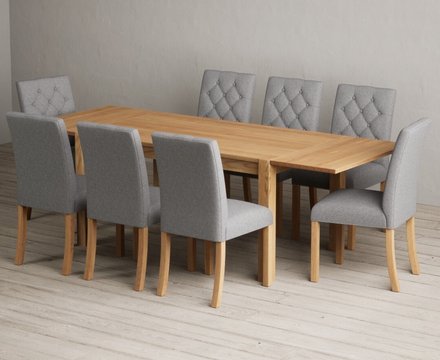Extending thetford 150cm solid oak table with 8 grey isabella chairs