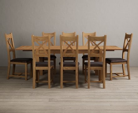 Extending thetford 150cm solid oak dining table with 8 brown natural solid oak chairs
