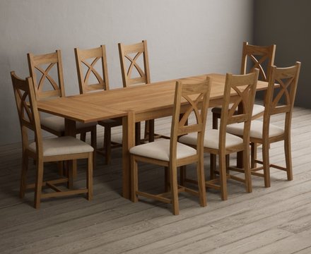 Extending thetford 150cm solid oak dining table with 8 linen natural solid oak chairs