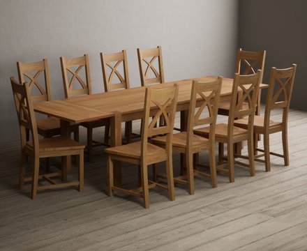 Extending thetford 180cm solid oak dining table with 10 oak natural chairs