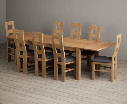 Extending thetford 180cm solid oak dining table with 8 charcoal grey natural chairs