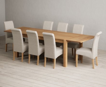 Extending thetford 180cm solid oak dining table with 8 natural scroll back chairs