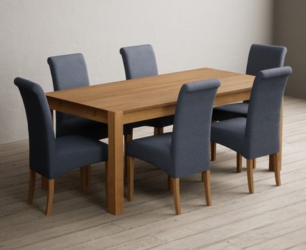 Extending thetford 180cm solid oak dining table with 6 blue scroll back chairs