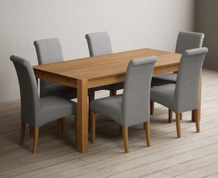 Extending thetford 180cm solid oak dining table with 6 grey scroll back chairs