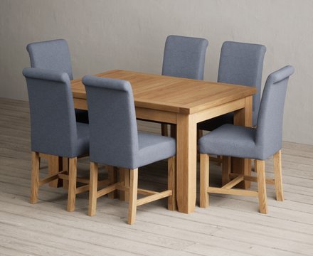 Extending yateley 130cm solid oak dining table with 6 blue braced chairs