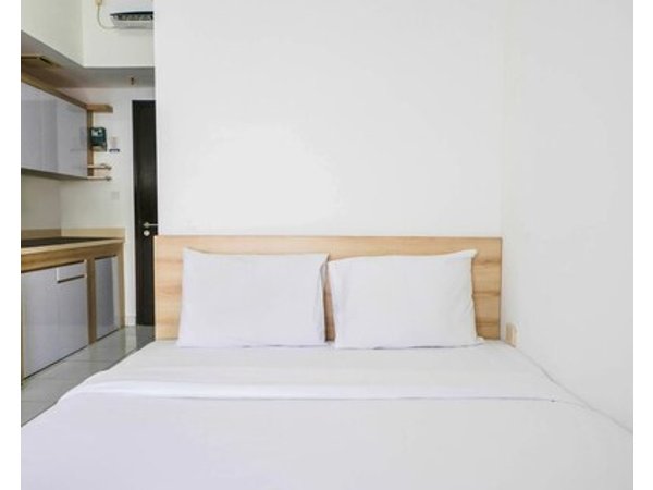 Homey Studio @ Casa De Parco Apartment By Travelio