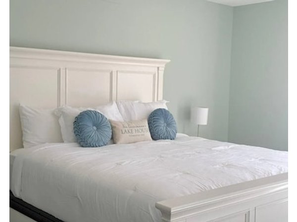 Shore Thing Getaway is a stunning Lake of the Ozarks lakefront home with 3 bedrooms 2.5 baths gourmet kitchen private dock kayaks firepit & grill