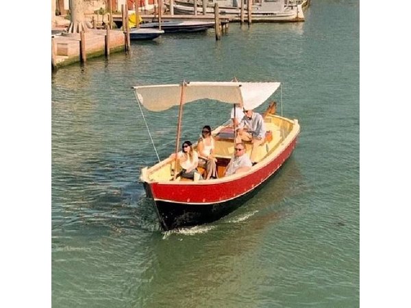 Sunset in a Typical Boat in Venice