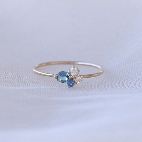 Eppi Goldener Cluster-Ring mit Topas, Saphir und Moissanit Avah