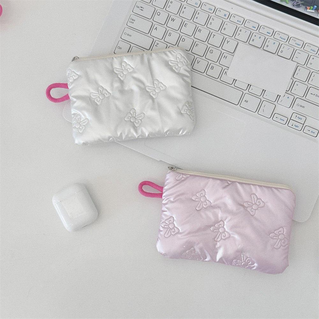 Bow embossed zip coin & makeup pouch, holds lipstick, cosmetics & earbuds, sleek & chic, girly style, portable for commute.