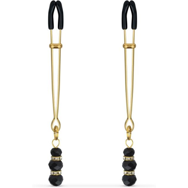 Pinces à mamelons dorées avec des perles noires