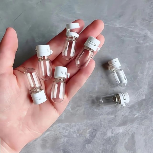 Zestaw 10 przezroczystych szklanych butelek 2 ml 3,1 x 1,3 cm Pojemniki podróżne z nakrętką na serum do twarzy, płyn do demakijażu lub esencję