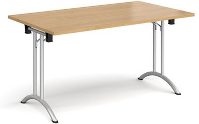 Office Monster | Dams Rectangular folding leg table with silver legs and curved foot rails 1400mm x 800mm - oak Dams Rectangular folding leg table with silver legs and curved foot rails 1400mm x 800mm - oak