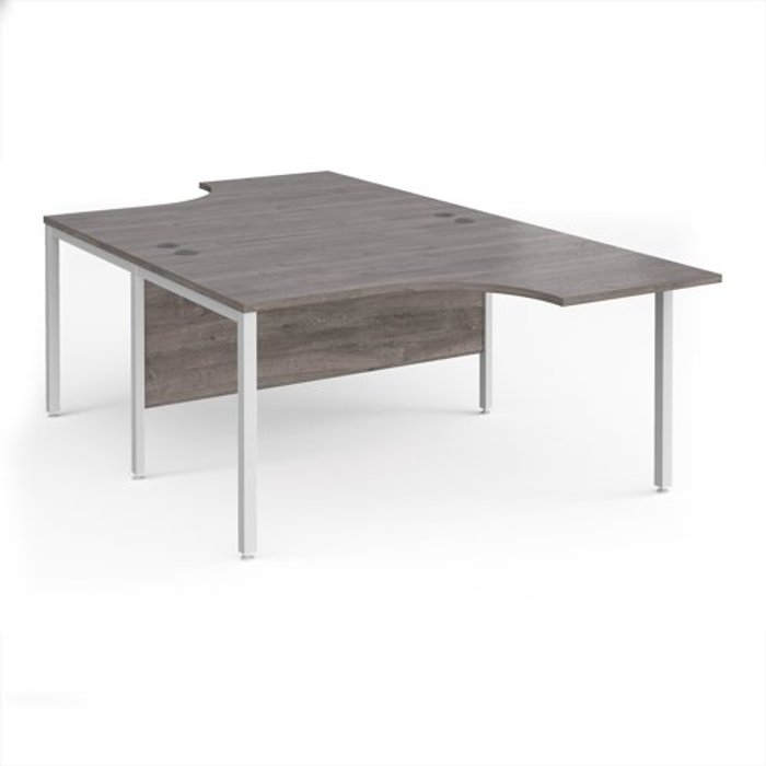 Office Monster | Maestro 25 Maestro 25 back to back ergonomic desks 1400mm deep - white bench leg frame, grey oak top Maestro 25 Maestro 25 back to back ergonomic desks 1400mm deep - white bench leg frame, grey oak top