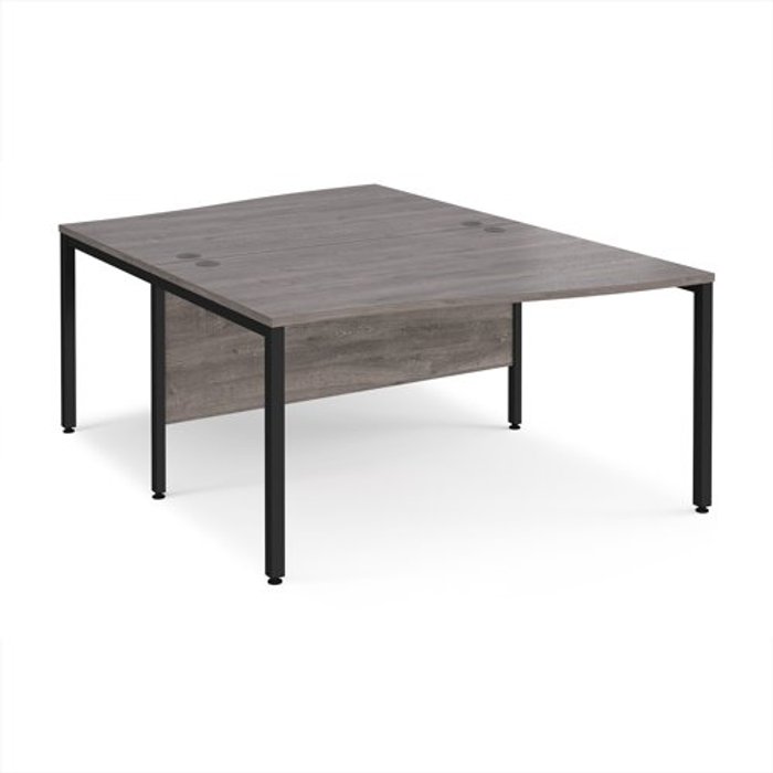 Office Monster | Maestro 25 Maestro 25 back to back wave desks 1400mm deep - black bench leg frame, grey oak top Maestro 25 Maestro 25 back to back wave desks 1400mm deep - black bench leg frame, grey oak top