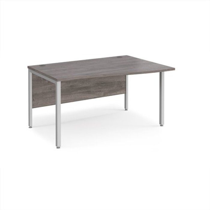 Office Monster | Maestro 25 Maestro 25 right hand wave desk 1400mm wide - silver bench leg frame, grey oak top Maestro 25 Maestro 25 right hand wave desk 1400mm wide - silver bench leg frame, grey oak top