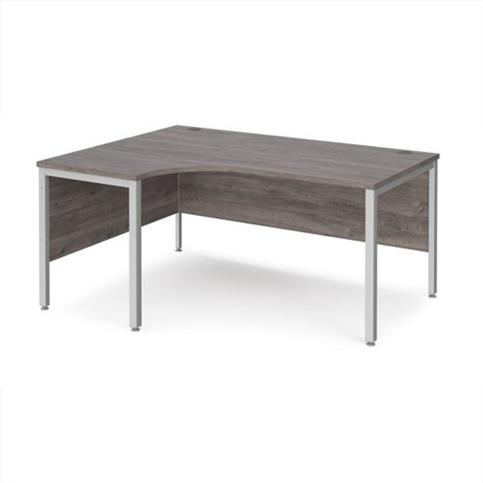 Office Monster | Maestro 25 Maestro 25 left hand ergonomic desk 1600mm wide - silver bench leg frame, grey oak top Maestro 25 Maestro 25 left hand ergonomic desk 1600mm wide - silver bench leg frame, grey oak top