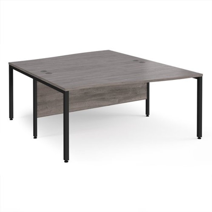 Office Monster | Maestro 25 Maestro 25 back to back wave desks 1600mm deep - black bench leg frame, grey oak top Maestro 25 Maestro 25 back to back wave desks 1600mm deep - black bench leg frame, grey oak top