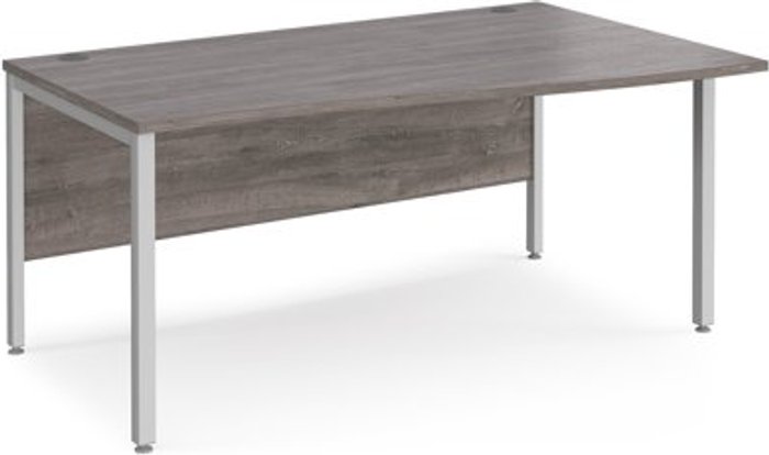 Office Monster | Maestro 25 Maestro 25 right hand wave desk 1600mm wide - silver bench leg frame, grey oak top Maestro 25 Maestro 25 right hand wave desk 1600mm wide - silver bench leg frame, grey oak top