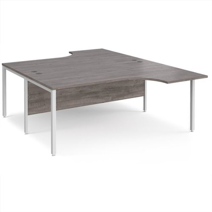 Office Monster | Maestro 25 Maestro 25 back to back ergonomic desks 1800mm deep - white bench leg frame, grey oak top Maestro 25 Maestro 25 back to back ergonomic desks 1800mm deep - white bench leg frame, grey oak top