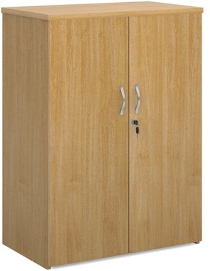 Office Monster | Universal Universal double door cupboard 1090mm high with 2 shelves - oak Universal Universal double door cupboard 1090mm high with 2 shelves - oak