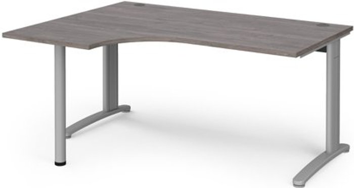 Office Monster | TR10 TR10 left hand ergonomic desk 1600mm - silver frame, grey oak top TR10 TR10 left hand ergonomic desk 1600mm - silver frame, grey oak top