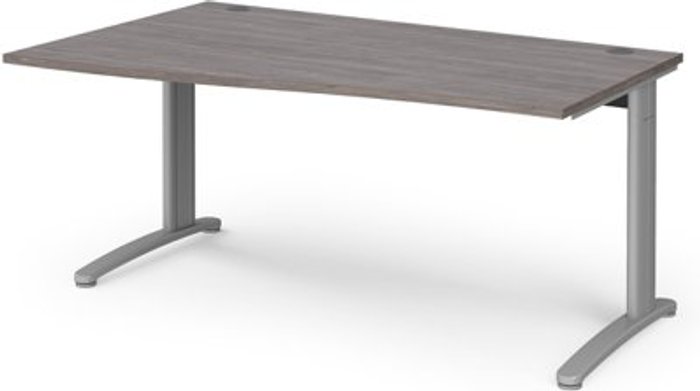Office Monster | TR10 TR10 left hand wave desk 1600mm - silver frame, grey oak top TR10 TR10 left hand wave desk 1600mm - silver frame, grey oak top