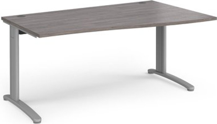 Office Monster | TR10 TR10 right hand wave desk 1600mm - silver frame, grey oak top TR10 TR10 right hand wave desk 1600mm - silver frame, grey oak top
