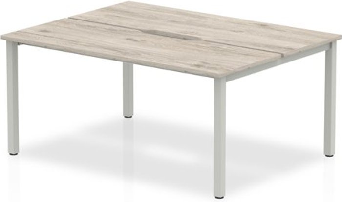 Office Monster | Evolve B2B Silver Frame Bench Desk 1400 Grey Oak (2 Pod) Evolve B2B Silver Frame Bench Desk 1400 Grey Oak (2 Pod)