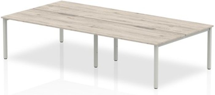 Office Monster | Evolve B2B Silver Frame Bench Desk 1600 Grey Oak (4 Pod) Evolve B2B Silver Frame Bench Desk 1600 Grey Oak (4 Pod)