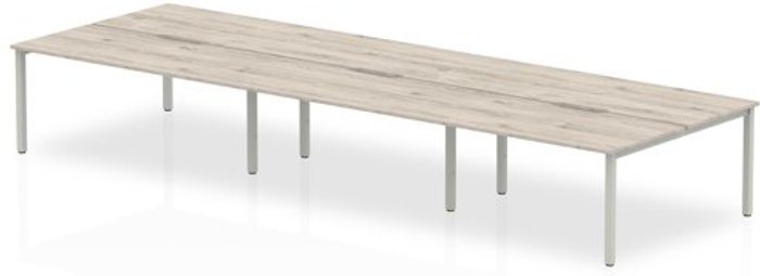 Office Monster | Evolve B2B Silver Frame Bench Desk 1400 Grey Oak (6 Pod) Evolve B2B Silver Frame Bench Desk 1400 Grey Oak (6 Pod)