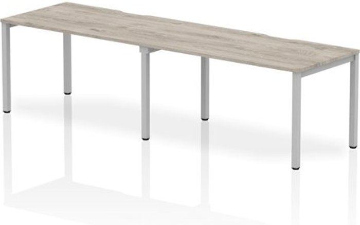 Office Monster | Evolve Single Silver Frame Bench Desk 1400 Grey Oak (2 Pod) Evolve Single Silver Frame Bench Desk 1400 Grey Oak (2 Pod)
