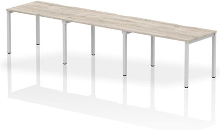 Office Monster | Evolve Single Silver Frame Bench Desk 1200 Grey Oak (3 Pod) Evolve Single Silver Frame Bench Desk 1200 Grey Oak (3 Pod)