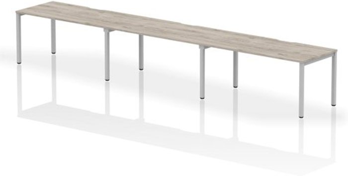 Office Monster | Evolve Single Silver Frame Bench Desk 1600 Grey Oak (3 Pod) Evolve Single Silver Frame Bench Desk 1600 Grey Oak (3 Pod)