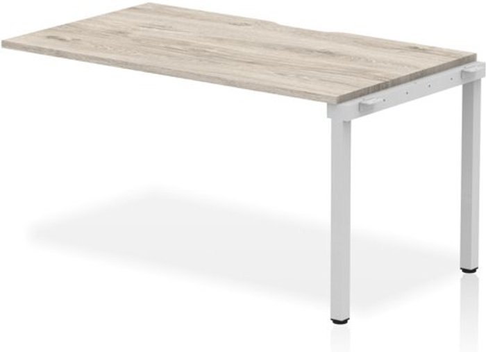Office Monster | Evolve Single Ext Kit Silver Frame Bench Desk 1400 Grey Oak Evolve Single Ext Kit Silver Frame Bench Desk 1400 Grey Oak