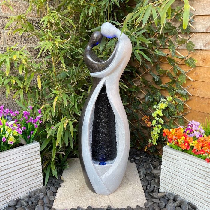 The Range | Tranquility Tranquility Couple Embrace Solar Powered Water Feature Tranquility Tranquility Couple Embrace Solar Powered Water Feature