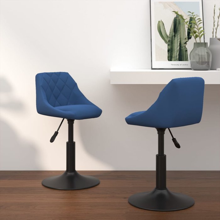 Juego de 2 sillas de comedor giratorias de terciopelo azul.