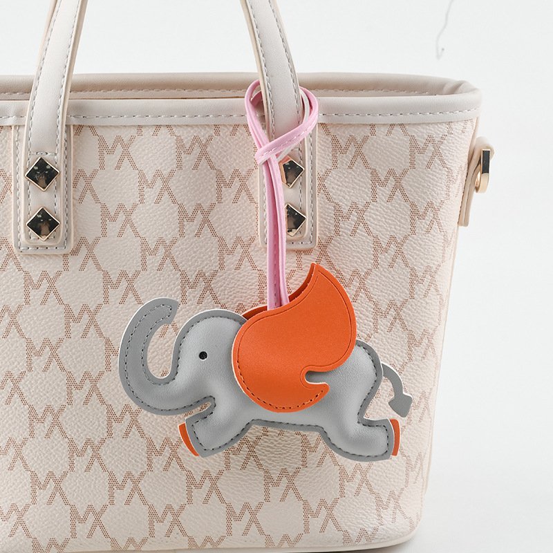 Mascot elephant leather keychain creative school bag car keychain three dimensional cute flying elephant pendant Christmas gift