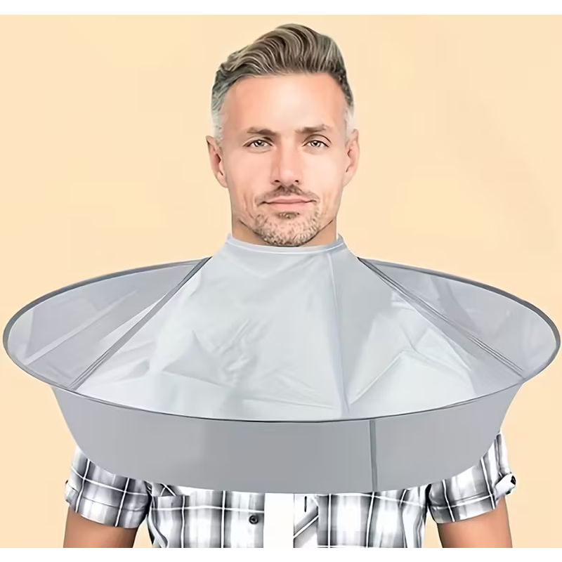 A Multifunctional Shaving Cape And A Comb, Designed For Collecting Hair While Trimming And Grooming Facial Hair